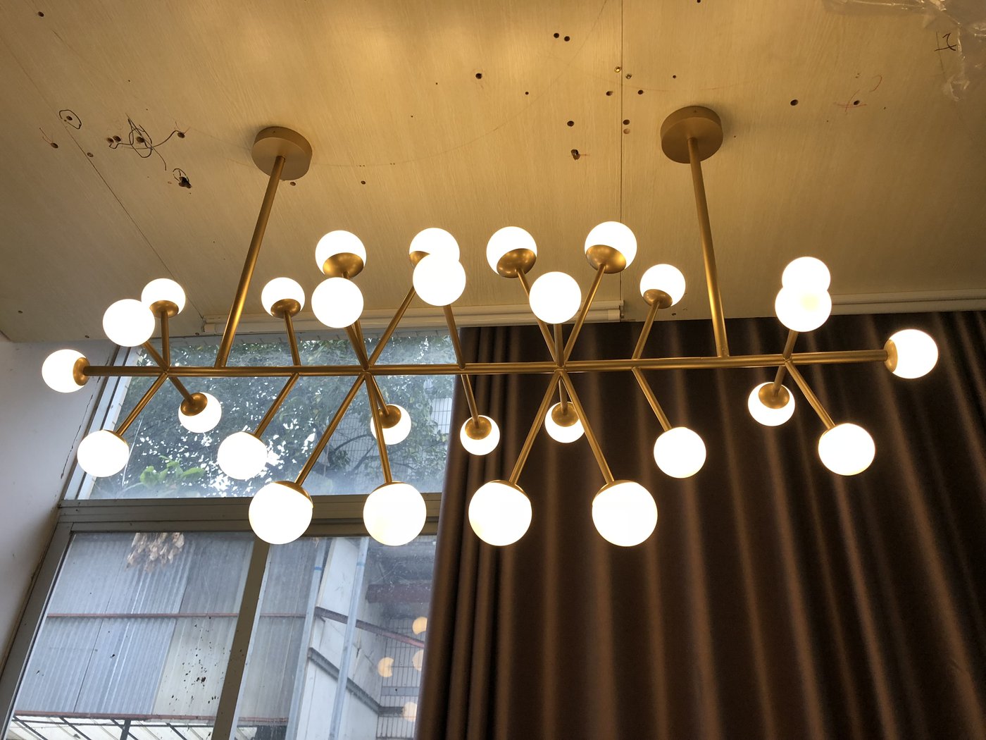 Brass branch and opal glass chandelier build in progress