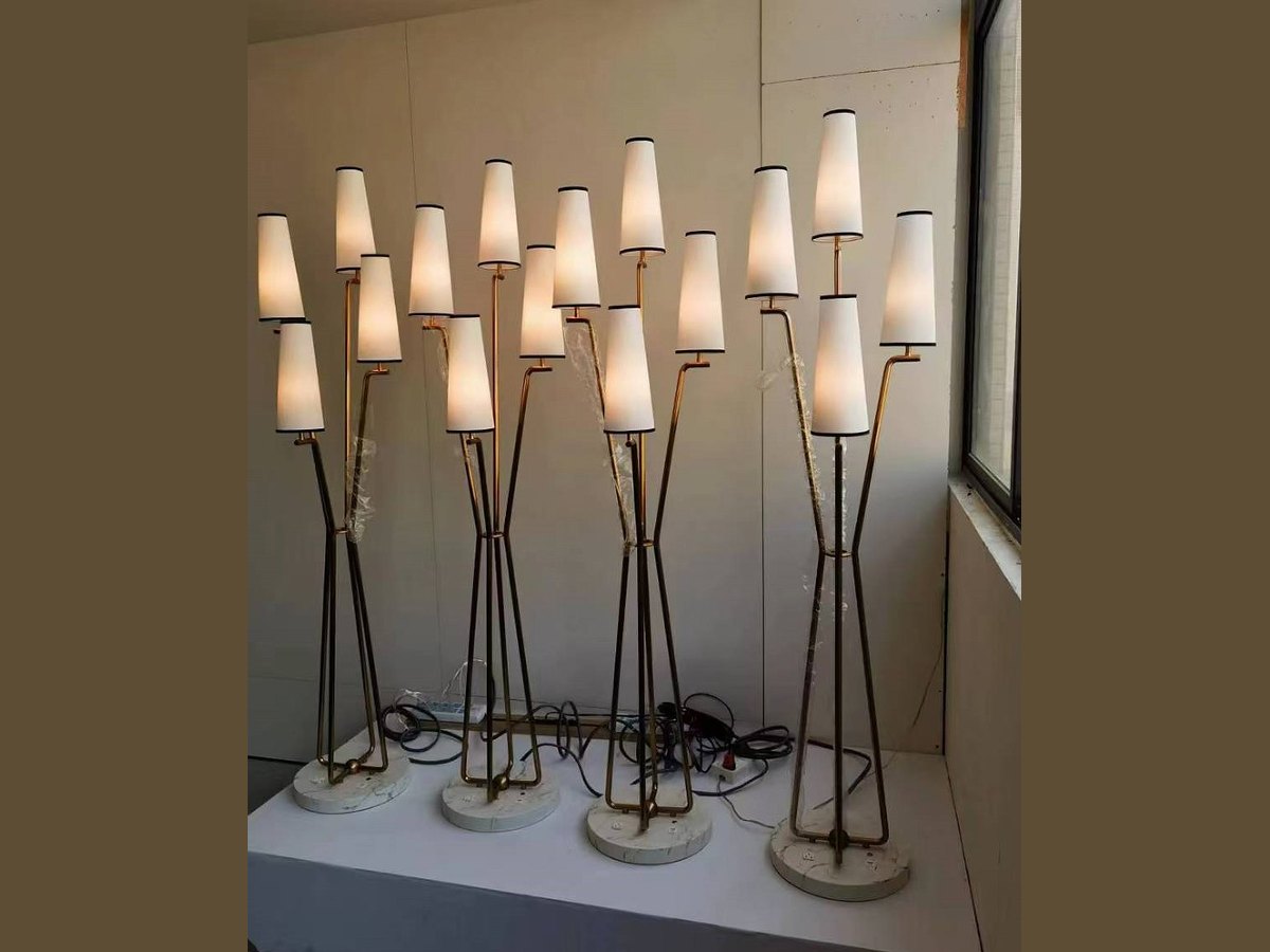 Brass floor lamp installed in a five-star hotel guestroom