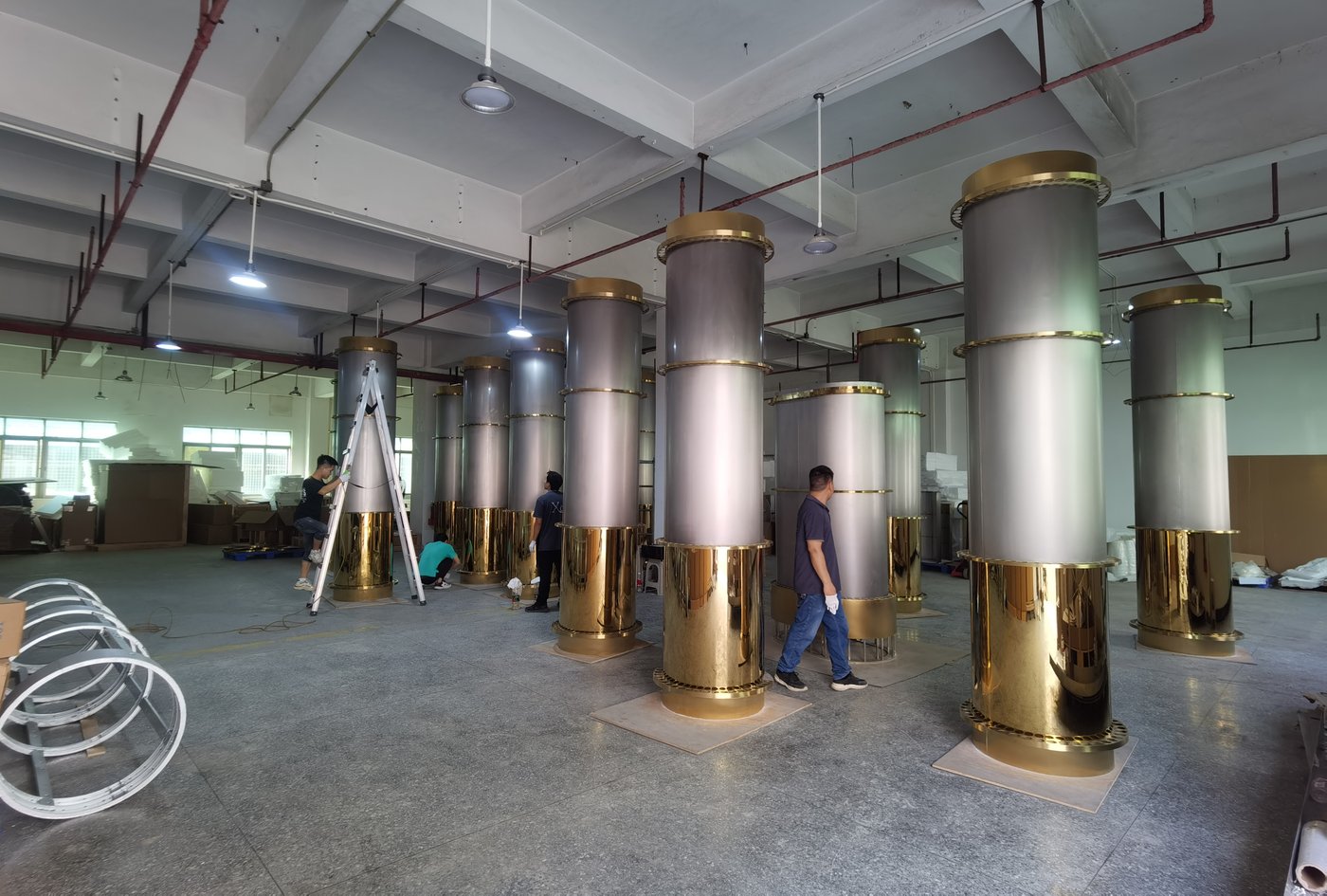 Champagne-gold column chandeliers in batch assembly