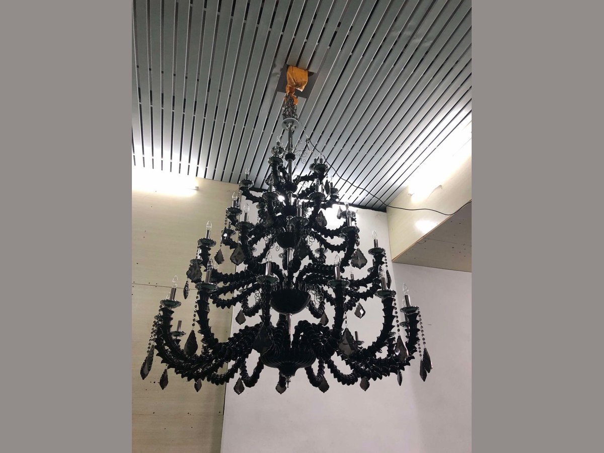 Black glass chandelier at ballroom scale