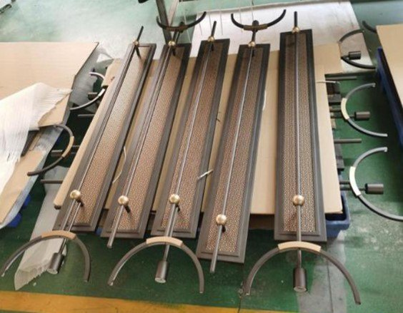 Wagon-wheel chandelier frame being hand-assembled